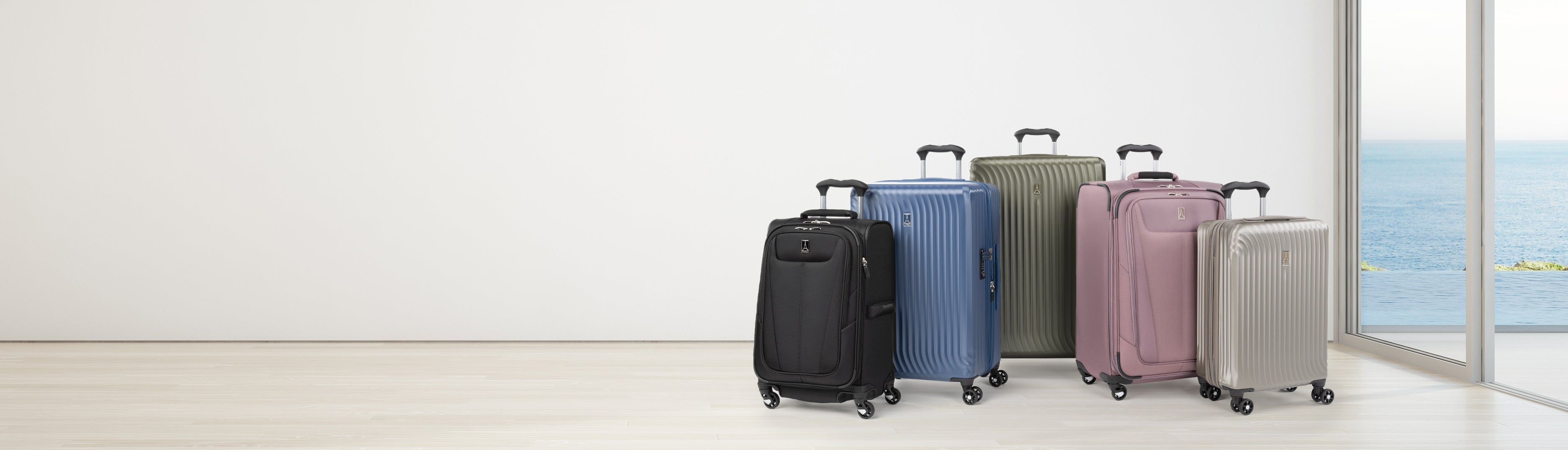 Hardside and softside luggage sitting by window