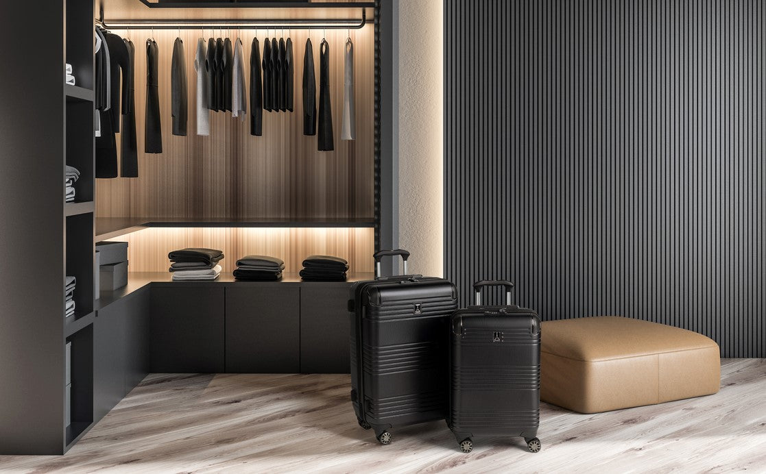 Roundtrip hardside spinner set sitting inside closet