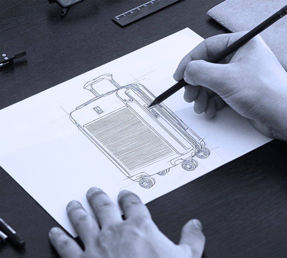 man sketching a drawing of hardside luggage